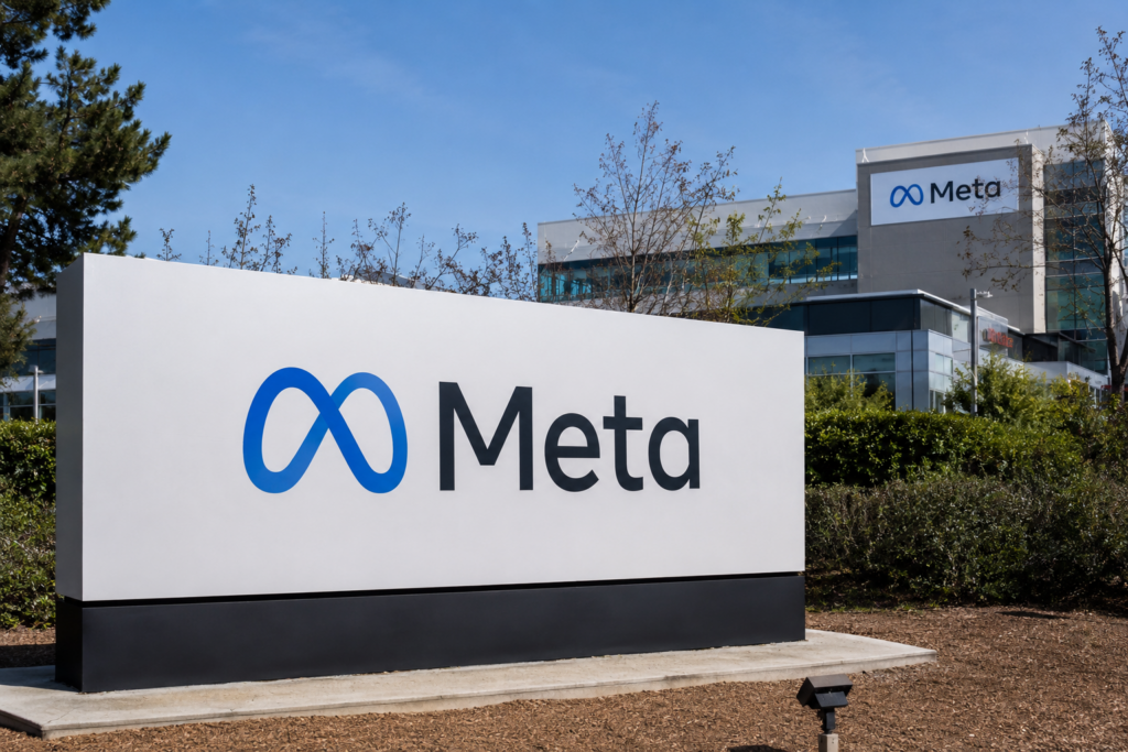 Meta logo displayed outside the company’s modern corporate office campus